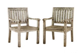 A pair of teak garden chairs,