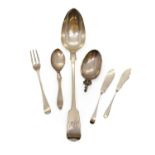 A group of silver flatware,