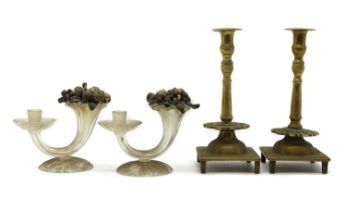 A pair of brass candlesticks