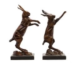 A pair of bronze fighting hares