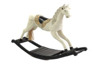 A painted wood rocking horse