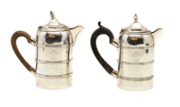 Two silver hot water jugs