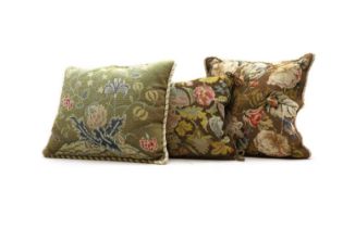 A group of three needlework cushions