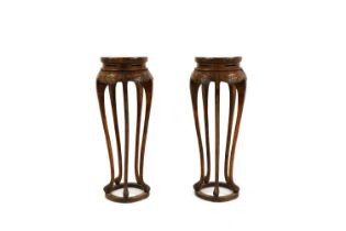A pair of Chinese hardwood jardiniere stands,