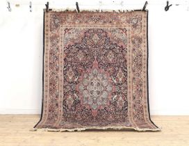 A Persian-style wool and silk rug