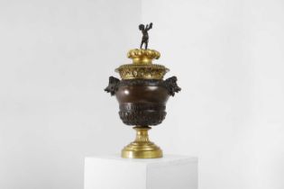 A grand tour patinated bronze and ormolu urn,