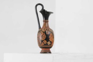 An Apulian red-figure trefoil oinochoe, attributed to the painter of the Macinagrossa Stand,