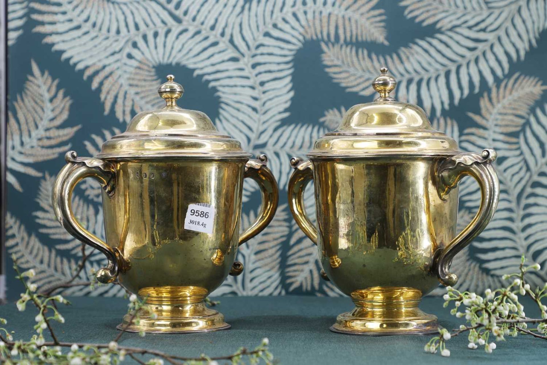 A George I and later composed pair of silver-gilt cups and covers - Image 2 of 7