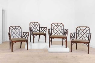 A set of four George III-style mahogany 'cockpen' elbow chairs,