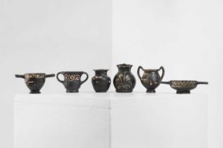 A group of six Xenon ware miniature pottery vessels,