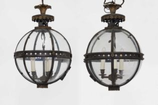 A pair of bronze, gilt-brass and glass 'Pennington' globe lanterns by Jamb,