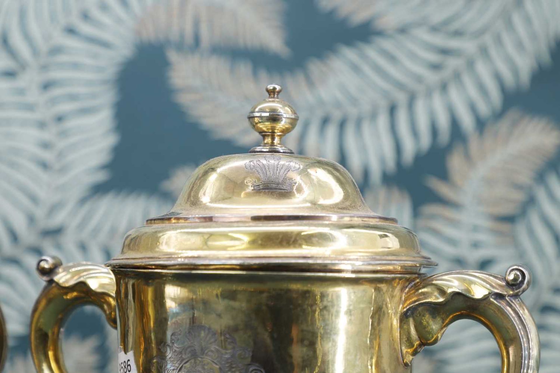A George I and later composed pair of silver-gilt cups and covers - Image 3 of 7