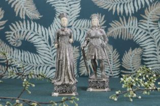 A pair of silver and ivory-mounted figures,