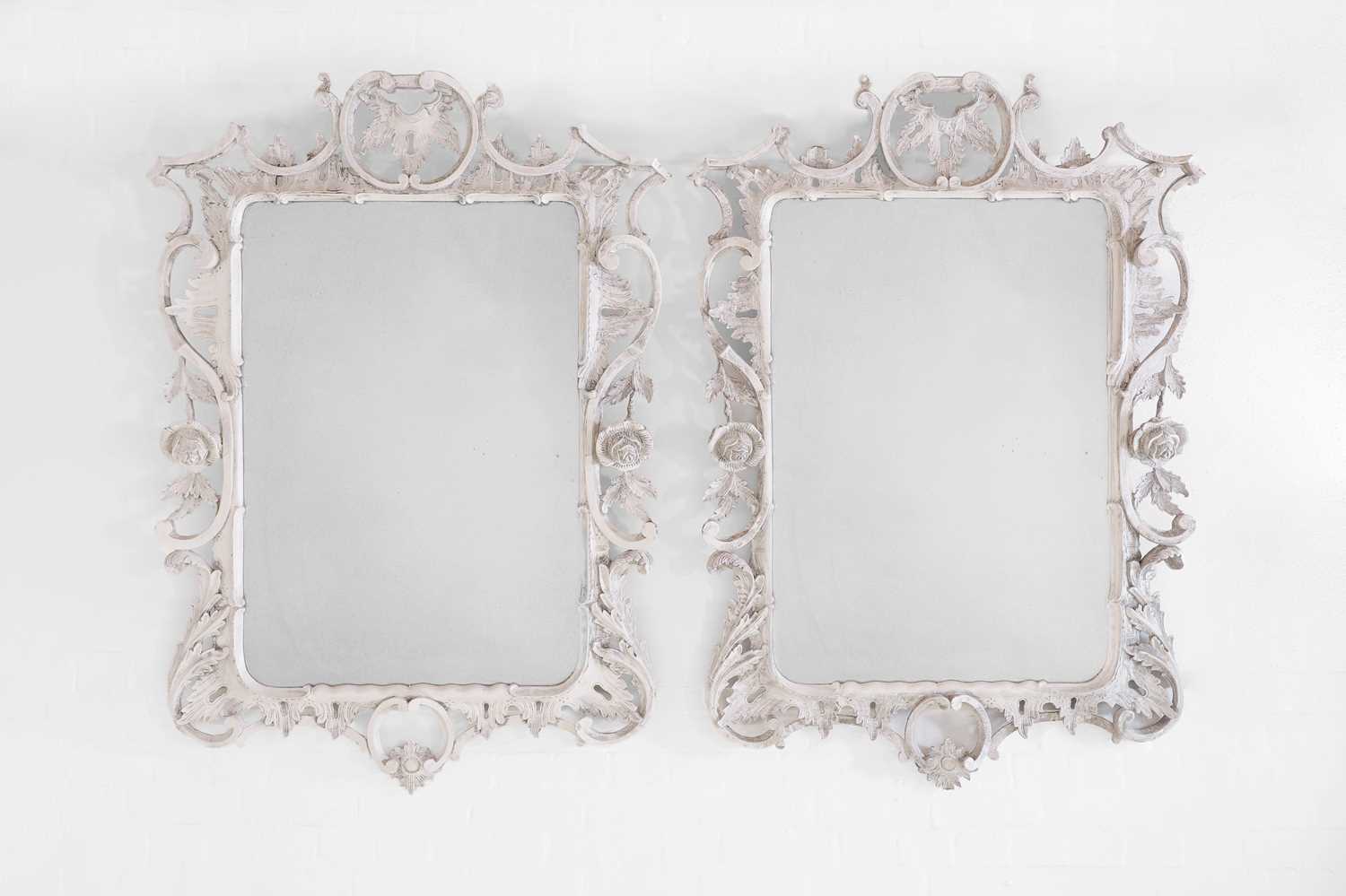 A pair of George III-style painted wooden mirrors,