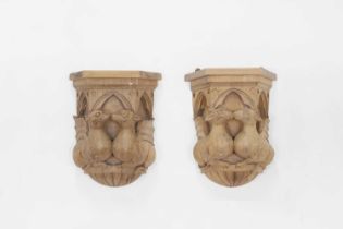 A pair of Gothic Revival carved wooden corbels,