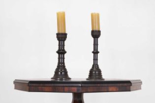 Two similar turned oak pricket candlesticks,
