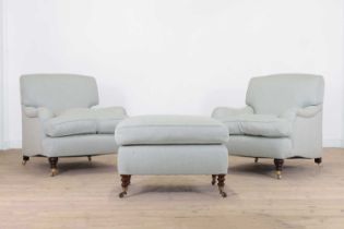 A pair of upholstered armchairs by George Smith,