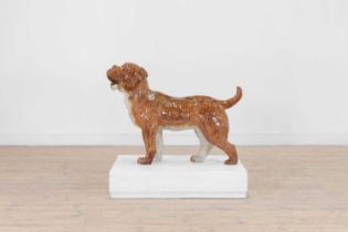 A glazed pottery boxer dog,