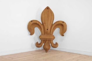 A large carved oak fleur-de-lys mount,