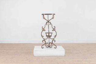 A gilt-japanned wrought-iron torchère stand,