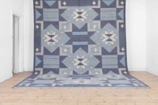 A flat-weave wool carpet of Scandinavian design,