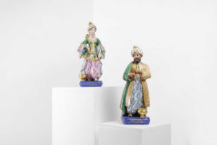 A pair of porcelain figural scent holders,