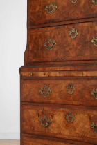 A George II figured walnut secretaire chest on chest,