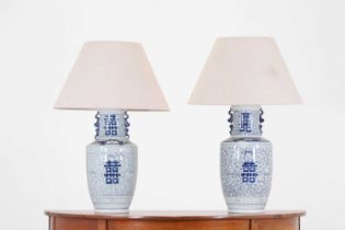 A pair of blue and white porcelain table lamps,