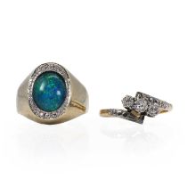 A gold diamond crossover ring and an opal triplet ring,