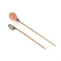 An antique coral and diamond stick pin and opal stick pin,