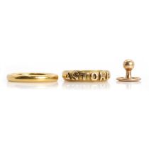 Two gold rings and a gold dress stud,