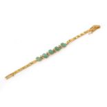 A gold diamond and jade bracelet,