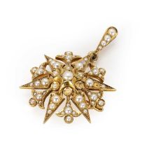 An Edwardian gold split pearl starburst brooch,