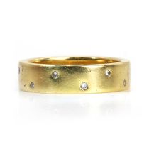 An 18ct gold diamond wedding ring,