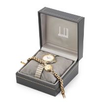 A stainless steel Dunhill quartz watch and a 9ct gold Tissot mechanical watch,