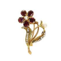 A garnet and seed pearl floral brooch,