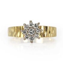 An 18ct gold diamond daisy cluster ring,