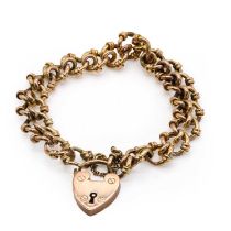 An Edwardian gold bracelet with a heart shaped padlock,