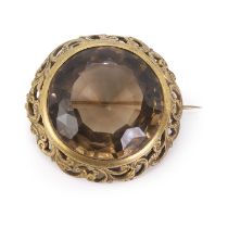 An antique silver gilt smoky quartz brooch,