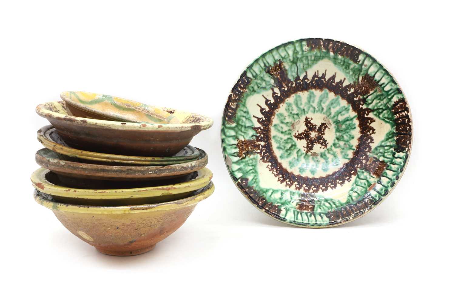 A collection of slipware bowls,