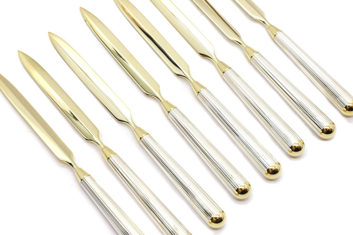 A group of eight silver letter openers
