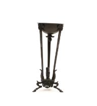 A tripod oil lamp