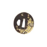 A Japanese iron and gold tsuba,