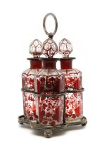 A set of three bohemian flashed glass decanters,