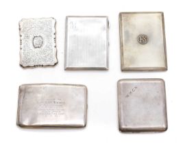 A group of four silver cigarette cases