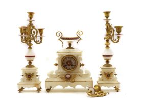 An alabaster mantel clock garniture