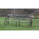 A wooden and wrought iron garden bench,