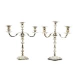 A pair of silver three branch candelabra,