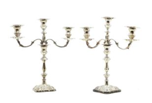 A pair of silver three branch candelabra,