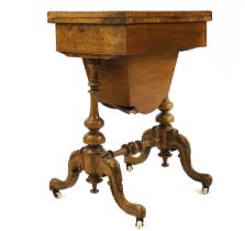 A Victorian figured walnut games work table,